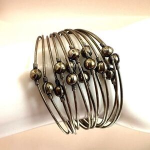 Silver tone multi strand cuff bracelet
